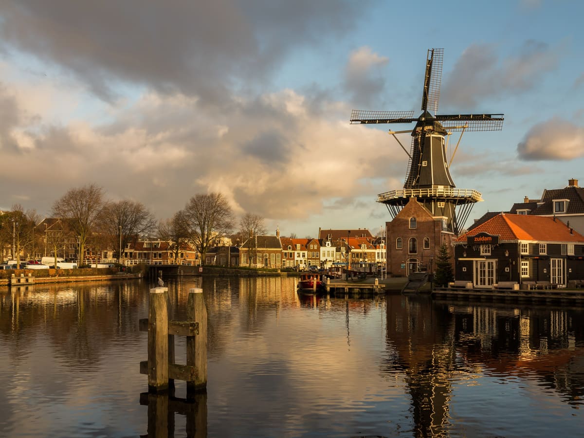 Windmill De Adriaan on the river Spaarne in Haarlem at sunset