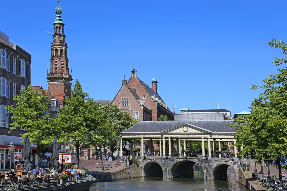 The Koornbrug bridge and the town hall tower over the Nieuwe Rijn canal in Leiden