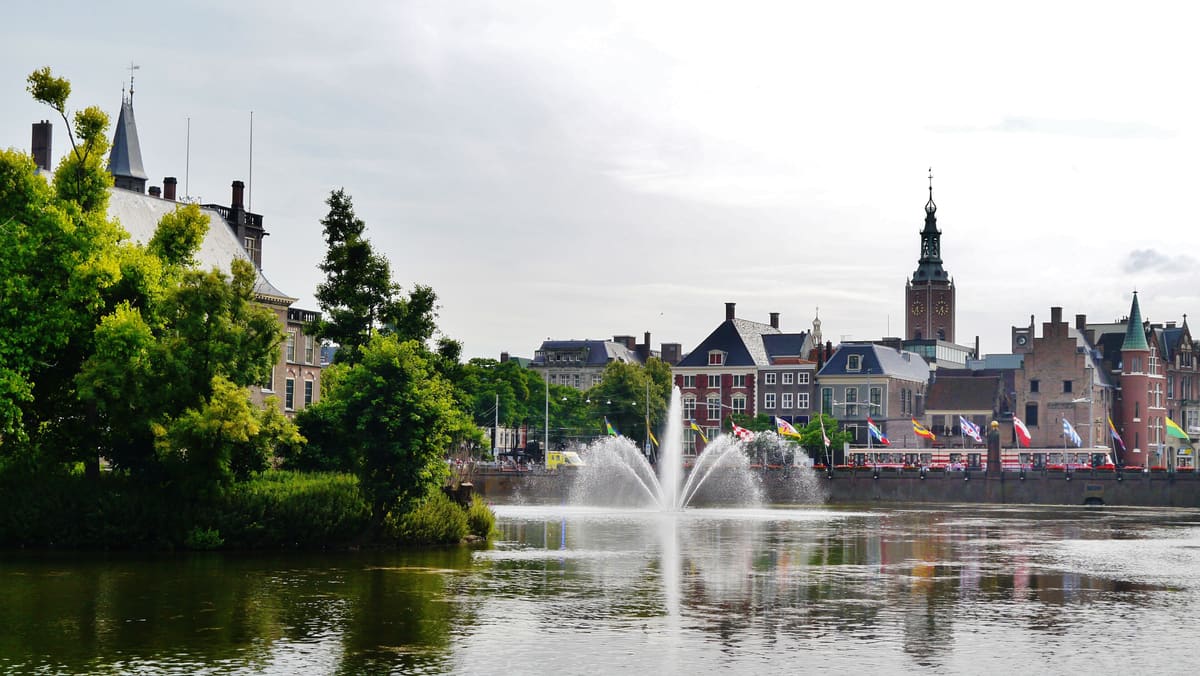 The Binnenhof parliament buildings reflected in the Hofvijver pond in The Hague